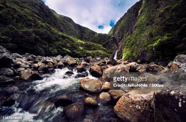 scenic view of river flowing through rocks against sky,taranaki,new zealand - mt taranaki stock pictures, royalty-free photos & images
