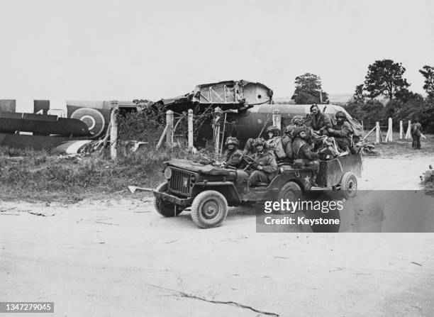Hiram Clough , Lance Corporal Joe Wilkenson and Kenneth Brierley of the 716 Light Composite Company RASC , British 6th Airborne Division in a Willys...