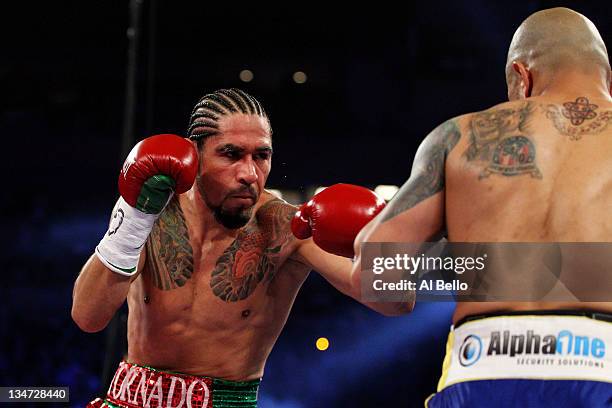 Antonio Margarito of Mexico throws a punch against Miguel Cotto of Puerto Rico in the first round during the WBA World Junior Middleweight Title...