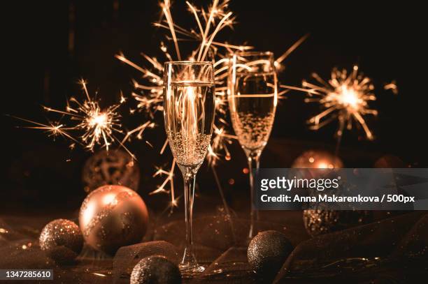 close-up of christmas decorations on table - シャンパン ストックフォトと画像