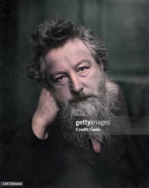 Head and shoulders portrait of British artist William Morris, 1889. Note: Image has been digitally colorized using a modern process. Colors may not...