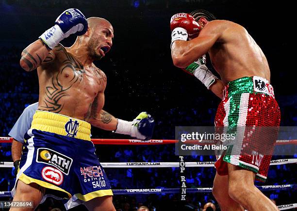 Miguel Cotto of Puerto Rico throws a left handed punch against Antonio Margarito of Mexico during the WBA World Junior Middleweight Title fight at...
