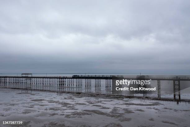 The train makes its way along Southend Pier, the longest pleasure pier in the world, on October 18, 2021 in Southend, England. The campaign to make...