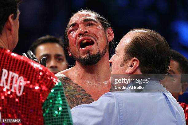 Antonio Margarito of Mexico reacts after referee Steve Smoger calls the fight due to Margarito's closed right eye against Miguel Cotto of Puerto Rico...
