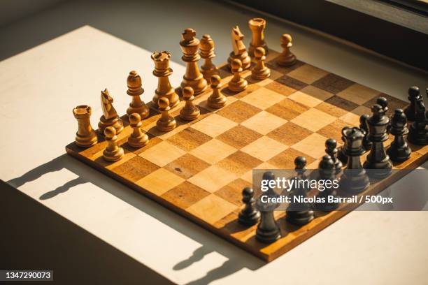 high angle view of chess board on table - échiquier photos et images de collection