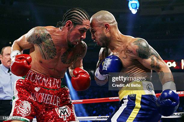 Miguel Cotto of Puerto Rico and Antonio Margarito of Mexico exchange blows during the WBA World Junior Middleweight Title fight at Madison Square...
