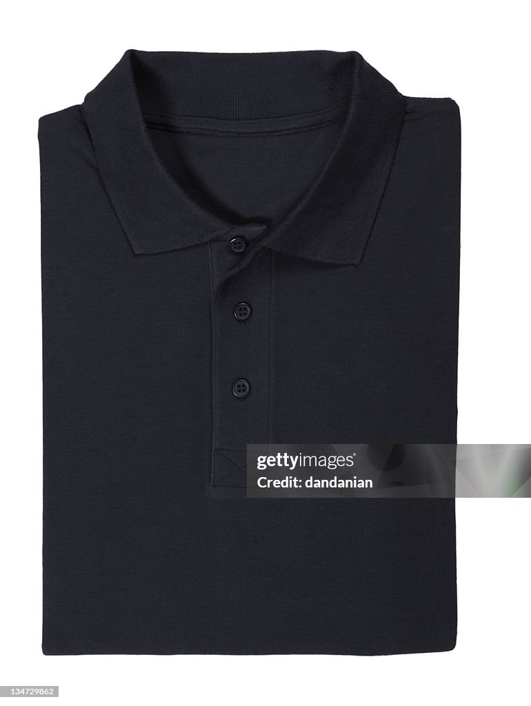 Folded black polo shirt isolated on white