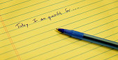 Gratitude notebook with pen writing today I am grateful for