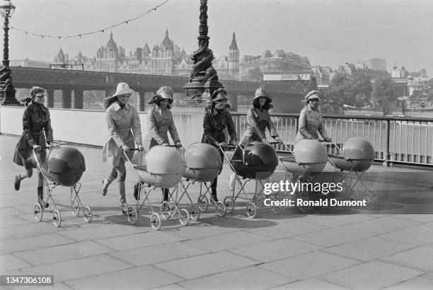 Six women pushing a new design of pram along the River Thames in London, UK, 27th September 1972.