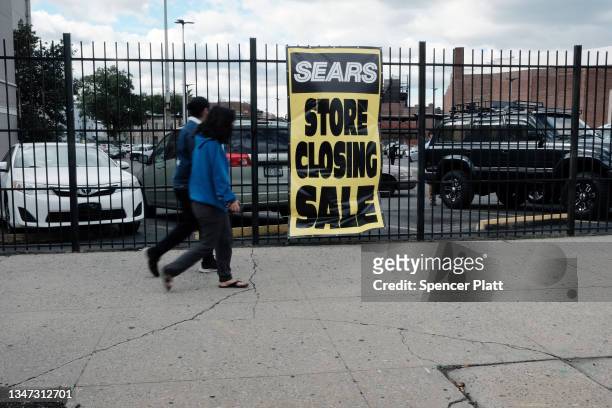 Pedestrians walk past a Sears store is seen on October 18, 2021 in the Flatbush neighborhood of Brooklyn borough in New York City. Sears, which filed...