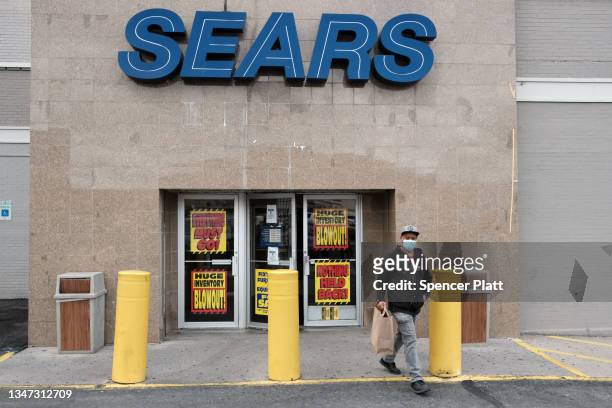 Person walks out of a Sears store stands on October 18, 2021 in the Flatbush neighborhood of Brooklyn borough in New York City. Sears, which filed...