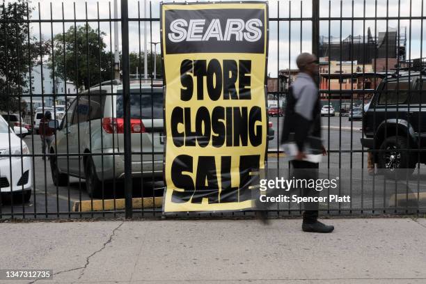 Person walks past a Sears store stands on October 18, 2021 in the Flatbush neighborhood of Brooklyn borough in New York City. Sears, which filed for...