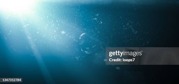 light and blue gradient background with dust defocused particles - flashlight dark stock illustrations