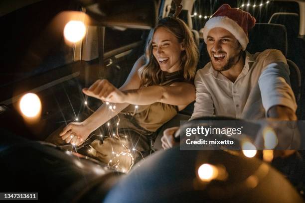 our little new year's party in the car - christmas driving stockfoto's en -beelden