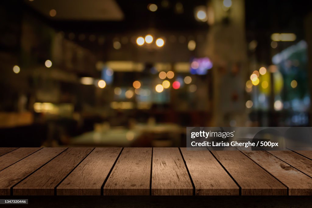 Close-up of wooden table in restaurant