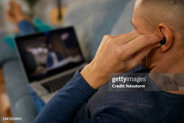 Man Calling Using Earbud 103 Man Putting In Earbuds Stock Photos, High-Res Pictures, and Images ...