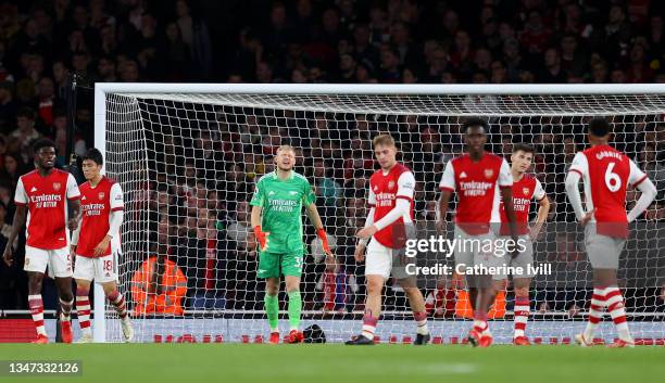 Aaron Ramsdale of Arsenal and his teammates look dejected after conceding their 2nd goal during the Premier League match between Arsenal and Crystal...