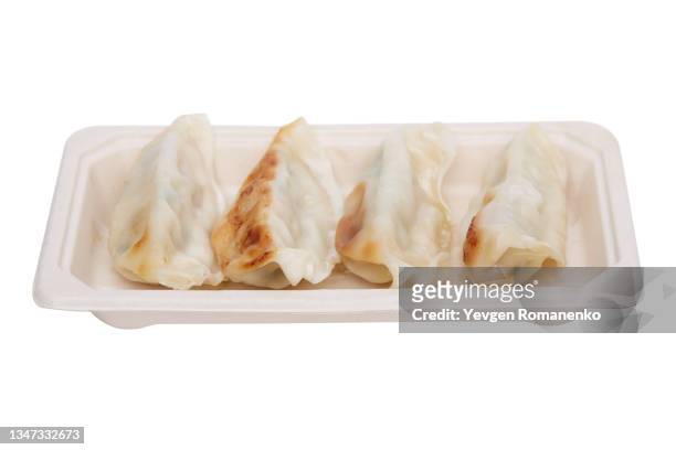 gyoza dumplings in a paper plate isolated on white background - chinese takeout 個照片及圖片檔