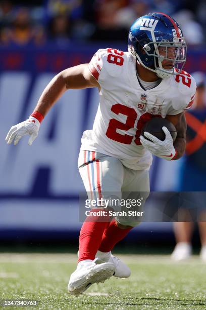 Devontae Booker of the New York Giants runs the ball during the first half against the Los Angeles Rams at MetLife Stadium on October 17, 2021 in...