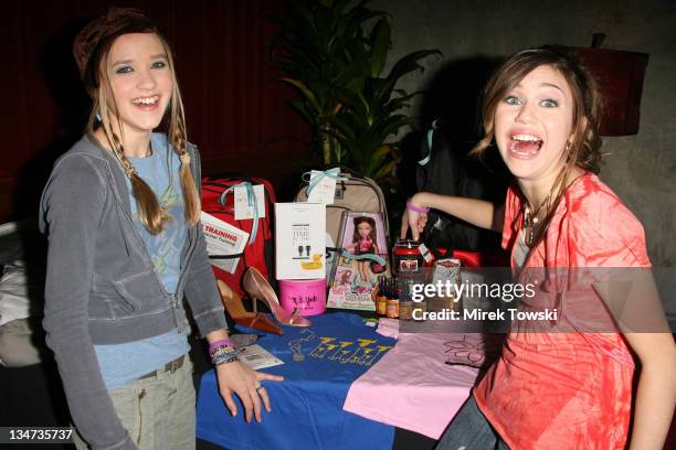 Emily Osment and Miley Cyrus during 2006 Celebrity Rock n Bowl with gift bags created by Klein Creative Communications at "Lucky Strike Lanes" in...