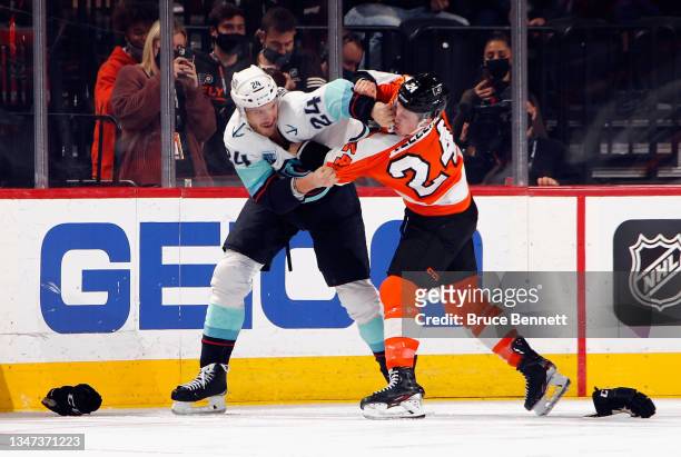 Nick Seeler of the Philadelphia Flyers fights with Jamie Oleksiak of the Seattle Kraken during the second period at the Wells Fargo Center on October...