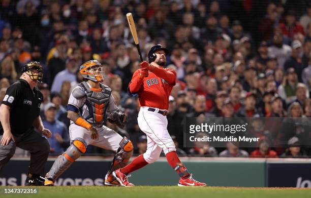 Kyle Schwarber of the Boston Red Sox hits a grand slam home run against the Houston Astros in the second inning of Game Three of the American League...