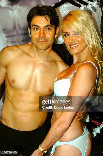 Nancy Sorrell and a male model during Nancy Sorrell Helps to Launch the "Check His Plums" Campaign at Anne Summers Oxford Street in London, United...
