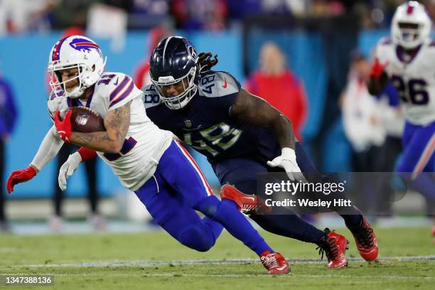 Wide receiver Cole Beasley of the Buffalo Bills is tackled by outside linebacker Bud Dupree of the Tennessee Titans during the second half at Nissan...