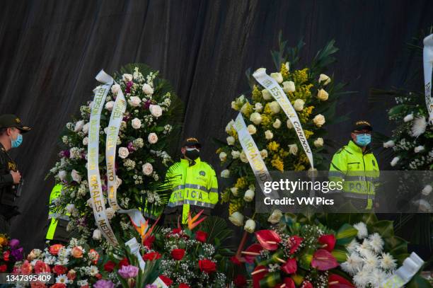 Several people gather at Plaza de Bolivar in front of the Congress Capitol in Bogota, Colombia to deliver funeral wreaths in memory and honor to the...