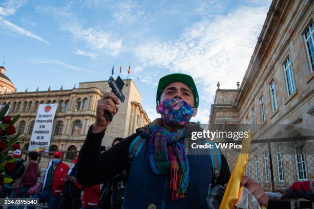 Several people gather at Plaza de Bolivar in front of the Congress Capitol in Bogota, Colombia to deliver funeral wreaths in memory and honor to the...