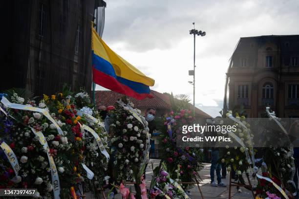 Several people gather at Plaza de Bolivar in front of the Congress Capitol in Bogota, Colombia to deliver funeral wreaths in memory and honor to the...