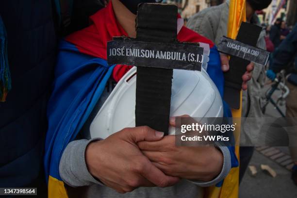 Several people gather at Plaza de Bolivar in front of the Congress Capitol in Bogota, Colombia to deliver funeral wreaths in memory and honor to the...