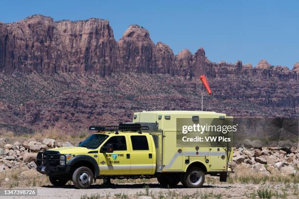 Bureau of Land Management Ford F-550 fire crew truck in front of the Moab Rim while working on a fire near Moab, Utah.