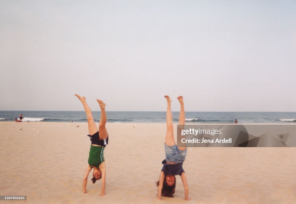 Best Friends Doing Handstands on Beach, Vintage 1990s Teens on Spring Break