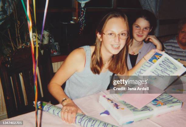 vintage photograph 90s teen birthday party, 1990s teenager with glasses and braces - 90's stock-fotos und bilder