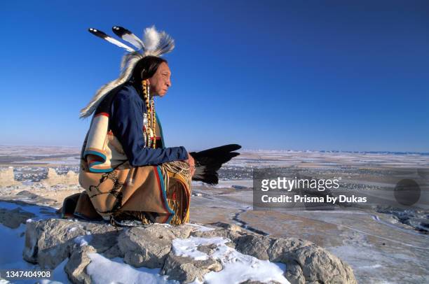 Great Plains, Western, Nebraska, Scotts Bluff, National Monument, Lakota elder Ron Hawks in winter landscaope MR.