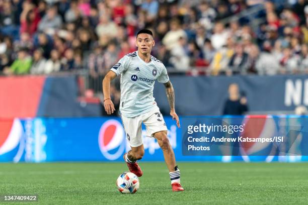 Federico Navarro of Chicago Fire dribbles at midfield during a game between Chicago Fire FC and New England Revolution at Gillette Stadium on October...