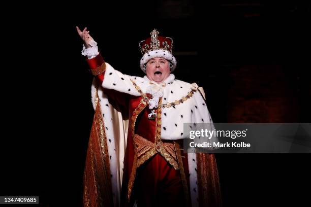 Brent Hill as Hamilton character His Majesty, King George III speaks on the stage announcing the re-opening of performances after COVID-19 lockdown...