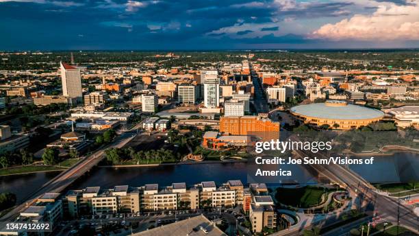 Drone aerial view of downtown Wichita Skyline features Arkansas Rivers and bridges, Kansas.
