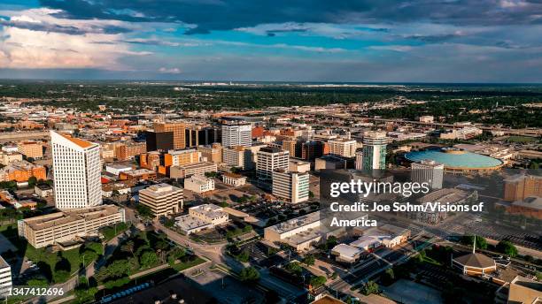 Drone aerial view of downtown Wichita Skyline features Arkansas Rivers and bridges, Kansas.