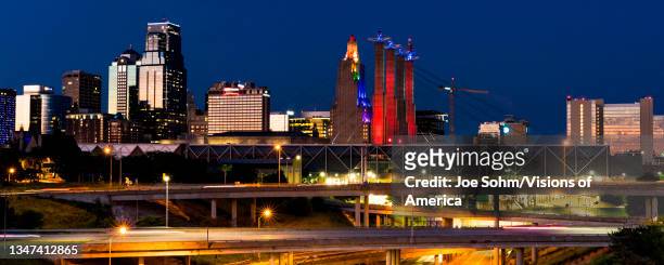 Kansas City Skyline at dusk with traffic and streaked lights and car trails, Missouri.