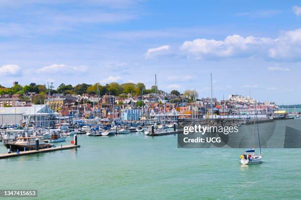 Yachts and boats moored in the marina in Cowes on the Isle of Wight.