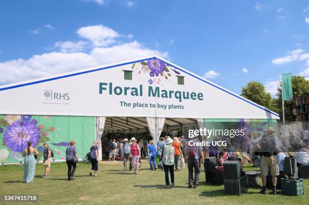 People visiting the huge Floral Marquee at RHS Hampton Court Palace Garden Festival formerly Hampton Court Flower Show.