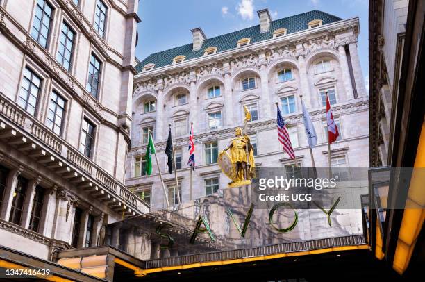 Exterior of The Savoy Hotel in London with its gilded statue of Peter II Count of Savoy above the entrance.