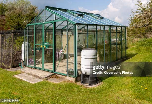 Glasshouse greenhouse in private garden private garden, Wiltshire, England, UK.