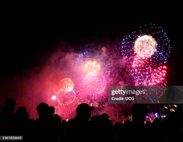 Crowds watching Macy's Fourth of July fireworks display, Manhattan.