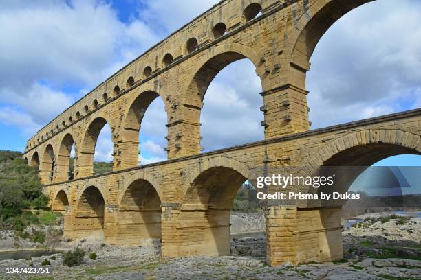 The Ancient Roman Pont du Gard aqueduct and viaduct bridge, the highest of all ancient roman bridges, near to Nimes in the South of France.