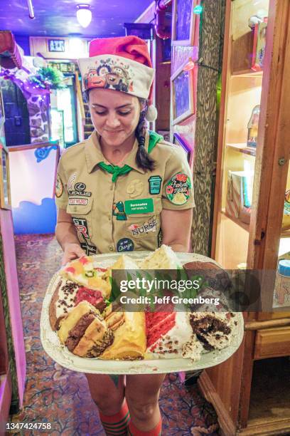 Florida, Captiva Island, Bubble Room, Christmas themed family restaurant, server with desert tray.