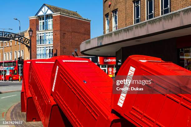 England, London, Kingston-upon-Thames, Sculpture Made of Dis-used Telephone Boxes titled 'Out of Order' by David Match.