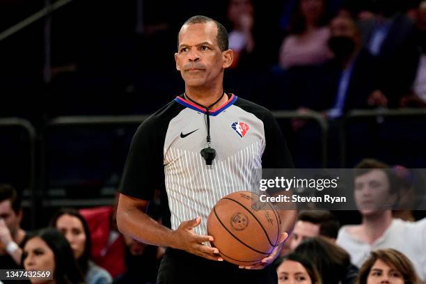 Referee Eric Lewis officiates a preseason game between the New York Knicks and the Washington Wizards at Madison Square Garden on October 15, 2021 in...